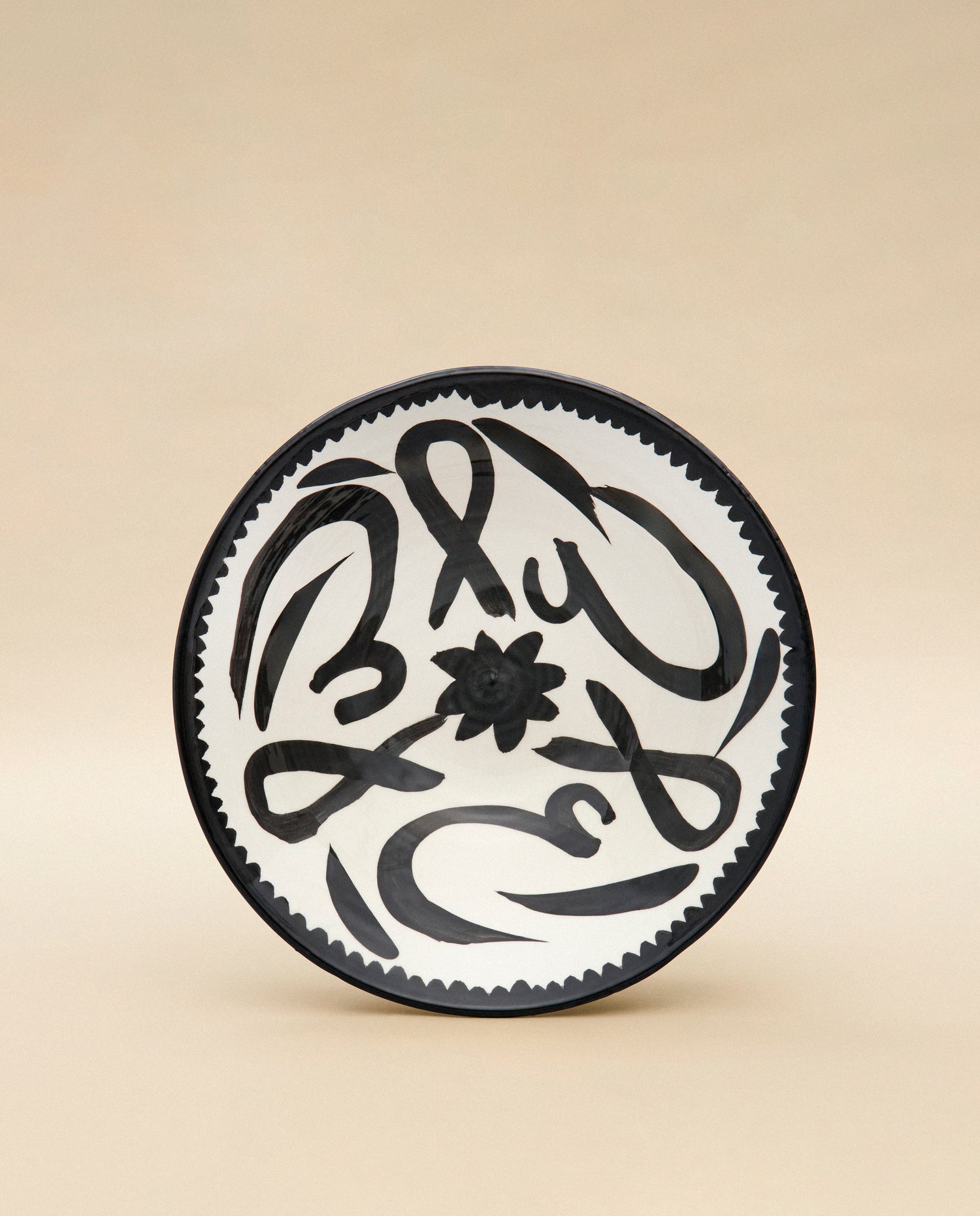 LEVANT's Calligraphy Serving Bowl in black and white. 