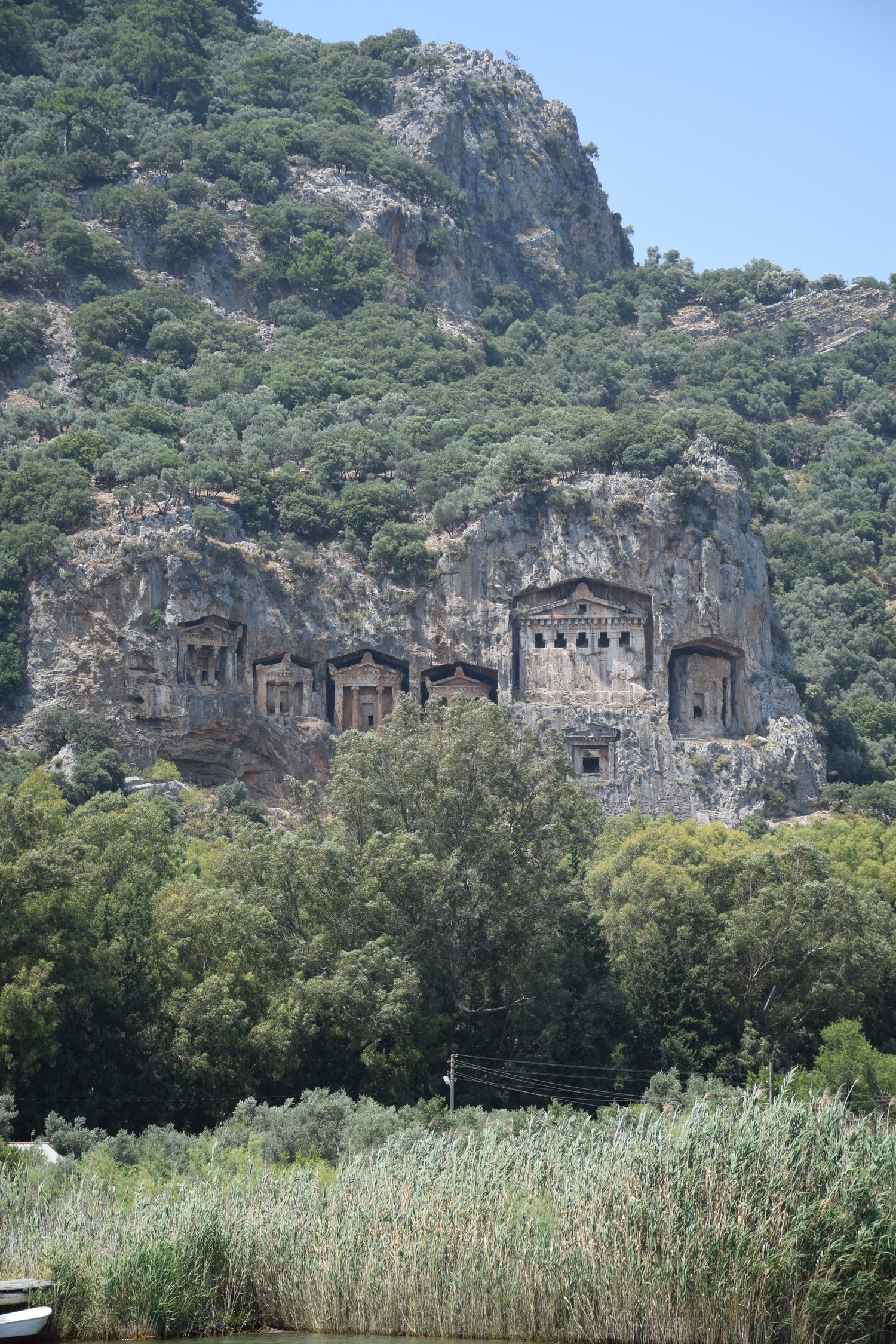 Lycian rock tombs carved into the cliff side.